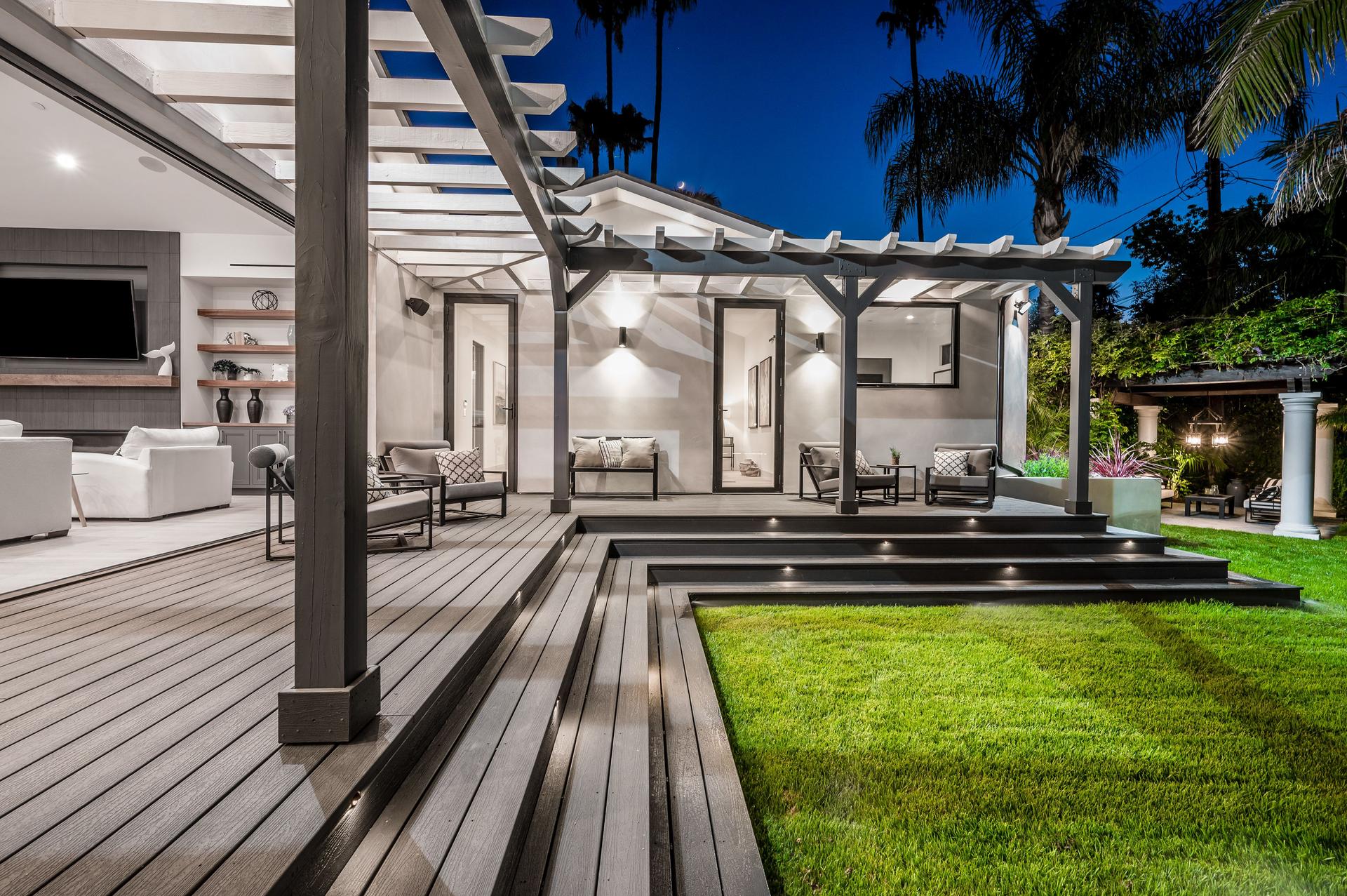 Outdoor seating area with sofas and a coffee table in a modern new construction home in Los Angeles